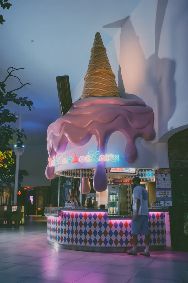 The finished cone towering over a customer at the counter