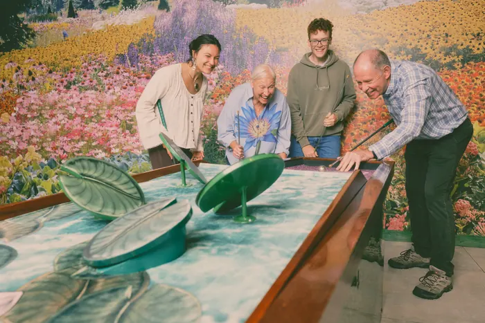 Guy Topping, Director of the Flower Bowl, taking a shot on the lily-pad hole