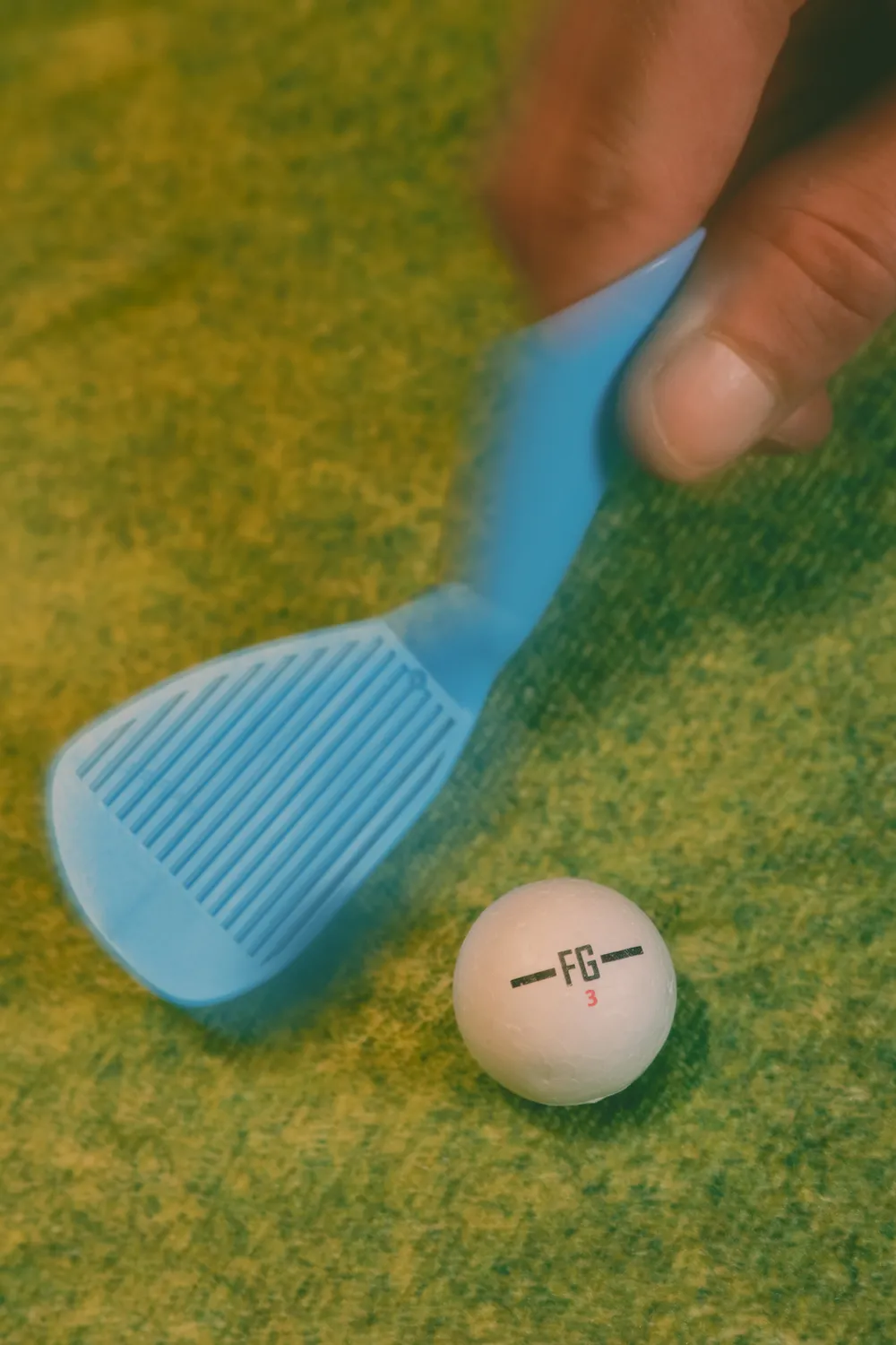 The tiny Finga Golf club and ball