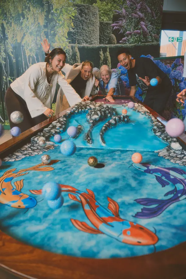 Balls flying over the koi-pond hole