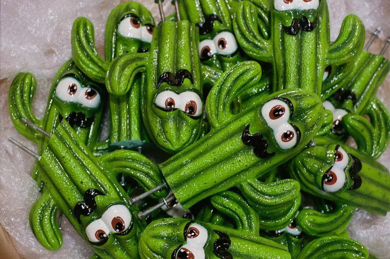 A pile of hand-finished cactus characters